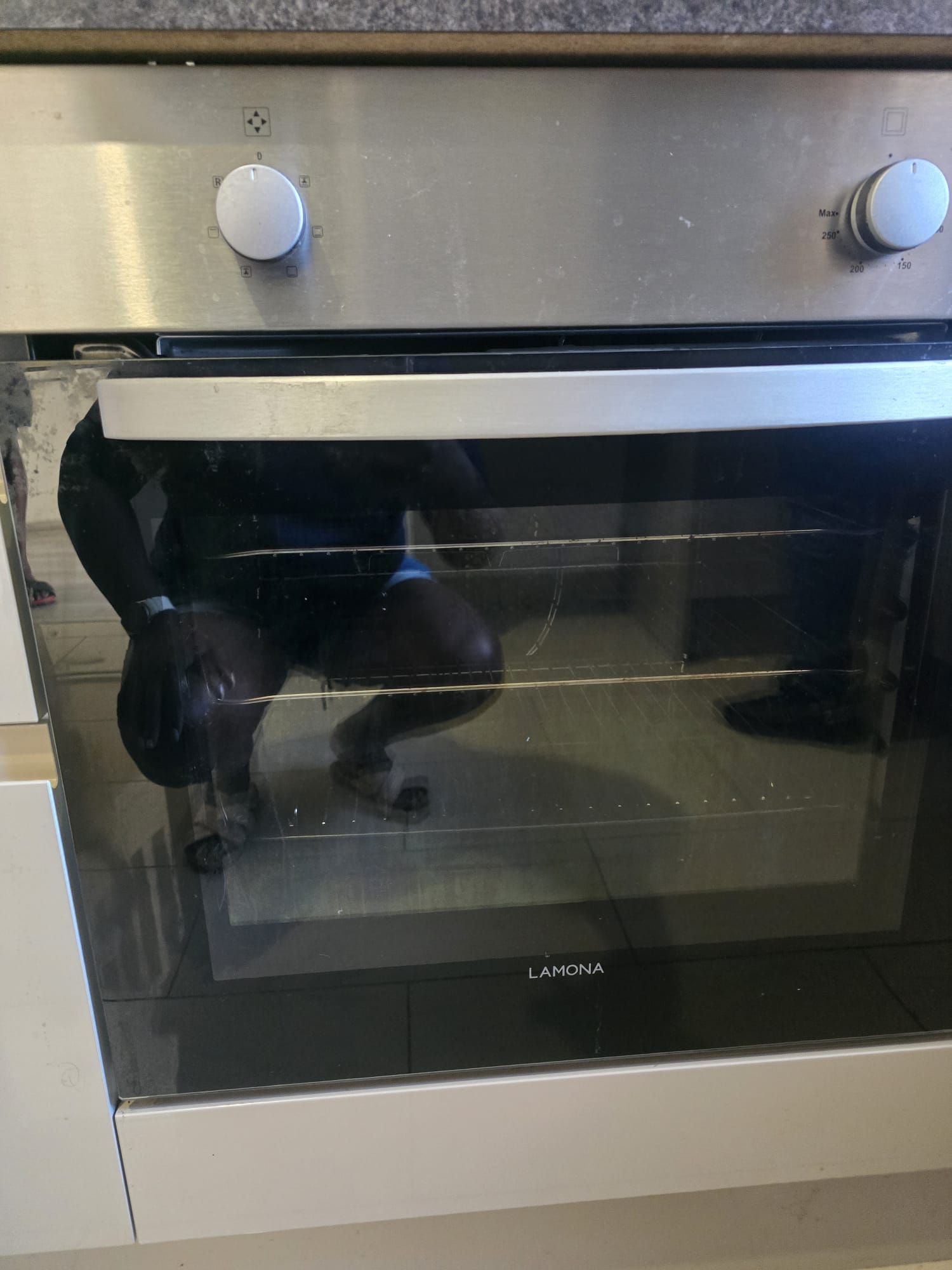 Oven door glass cleaned by ST HECS oven cleaning in Luton
